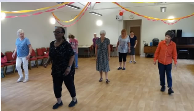 older people line dancing 