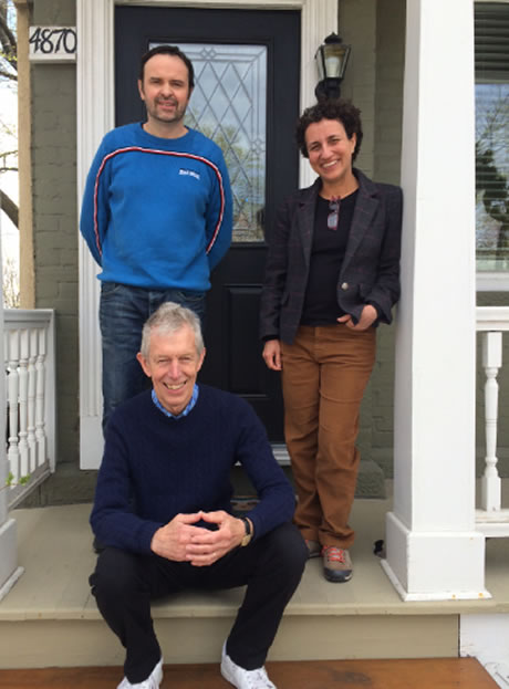 Alan Bignall now in present day sitting on steps of old house