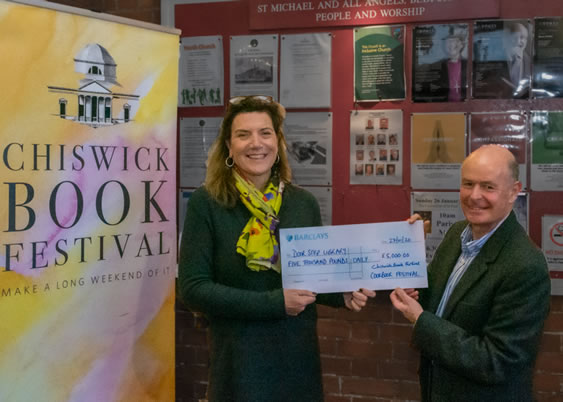door step library gets cheque for charity 