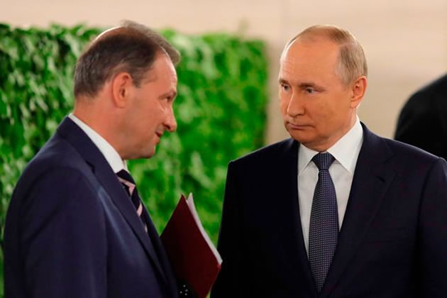 Sergey Brilev (left) with Vladimir Putin