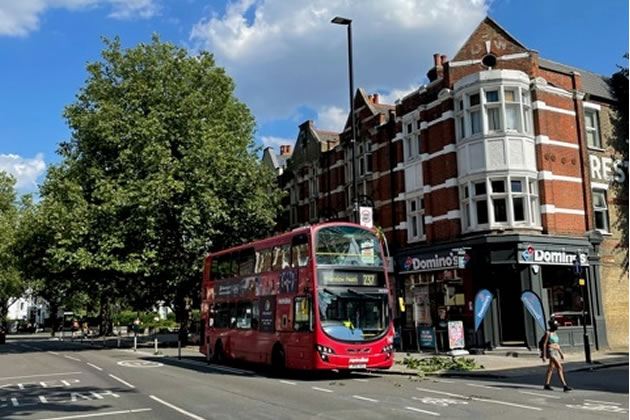 Bus travels down Cycleway 9 on Chiswick High Road