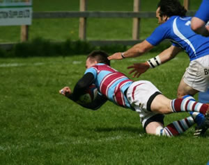 chiswick rugby club player in action getting a try 