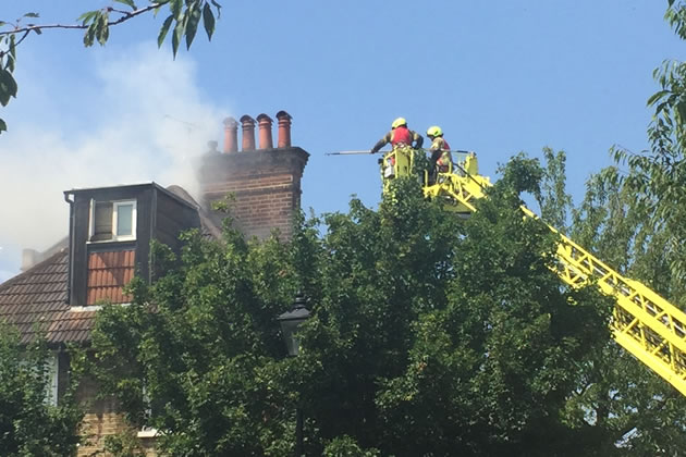 Firefighters use elevated platform to tackle the fire