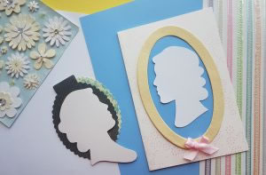image of georgian cut patterns on card of womens heads in silhouette