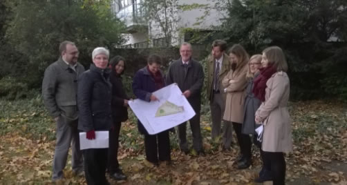 the design team and trustees of Hogarth Trust look at the plans for the garden 