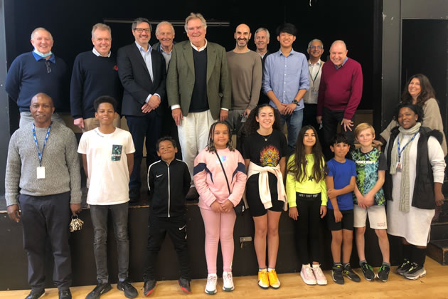 Youth club members with volunteers and sponsors