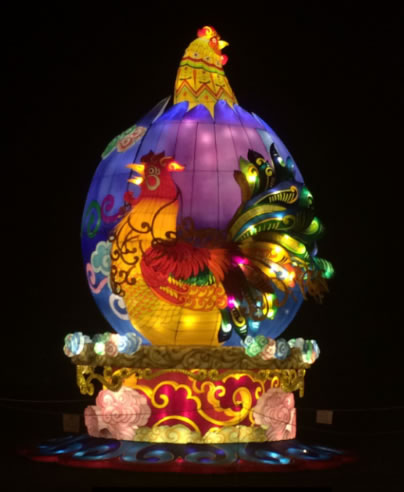 giant rooster illuminated at the festival 