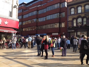 crowds gather in Lyric square waiting for all clear