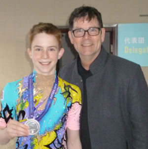 Max Crawford with his silver medal and his father Sean 
