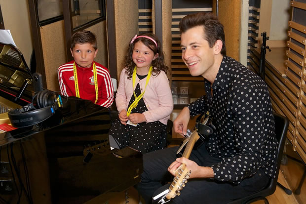 Mark Ronson songwriter with children at Metropolis studio chiswick for charity event