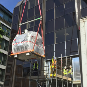 MRI scanner being lifted into the new clinic 