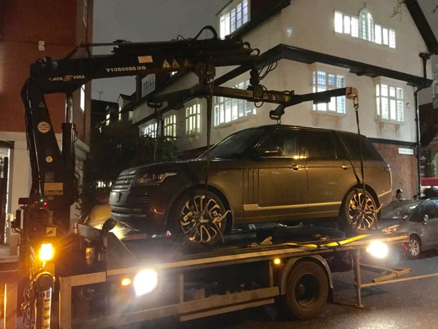 car being towed away by police for having no insurance