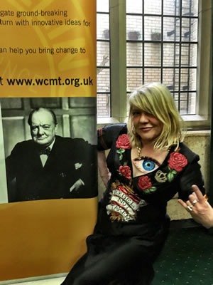 carrie reichardt with winston churchill poster