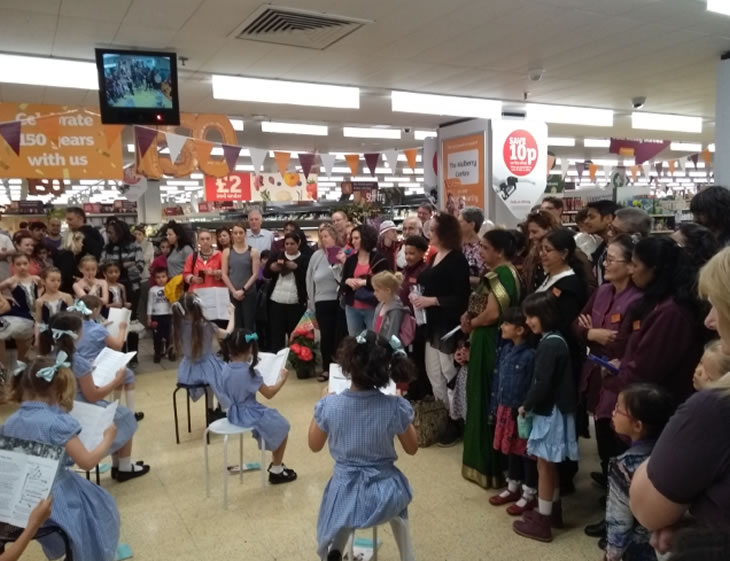 children perform a musical show in sainsburys 