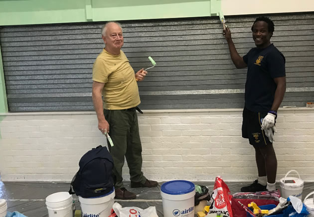 two local councillors painting school 