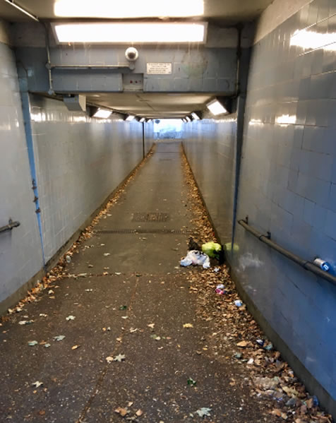 gloomy litter strewn subway 