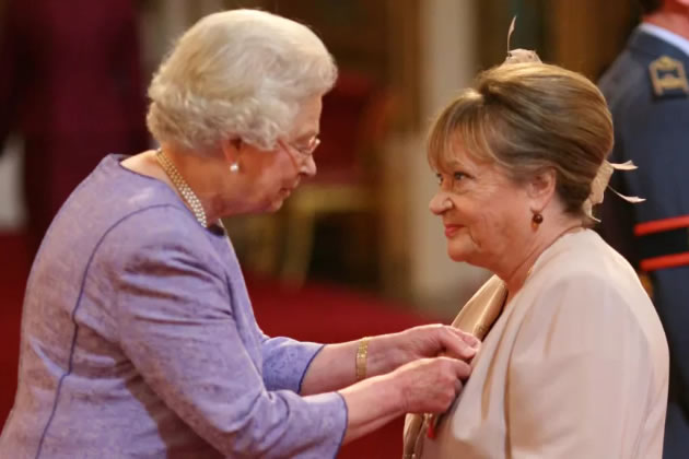 Sylvia Syms receives her OBE from the Queen in 2007 