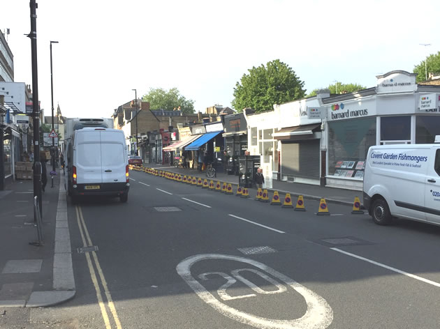 Bays coned off on Turnham Green Terrace