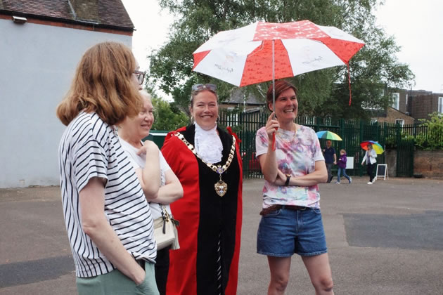 The Mayor of Hounslow braves the rain at the school fair