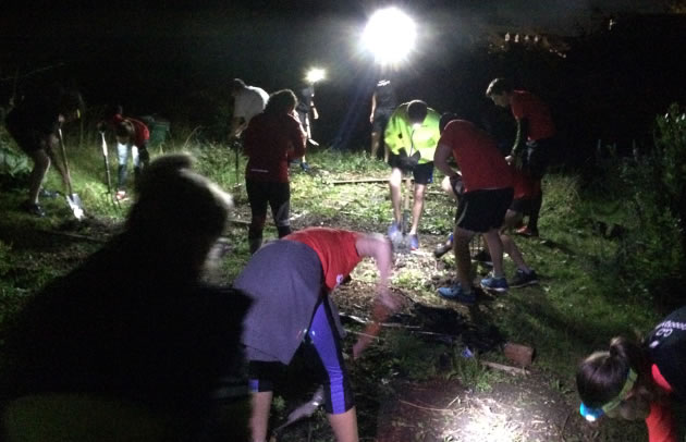 Gardening team working at night with the support of volunteers from The Good Gym