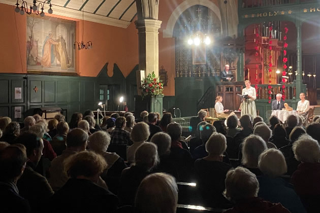 A packed church listens to the readings 