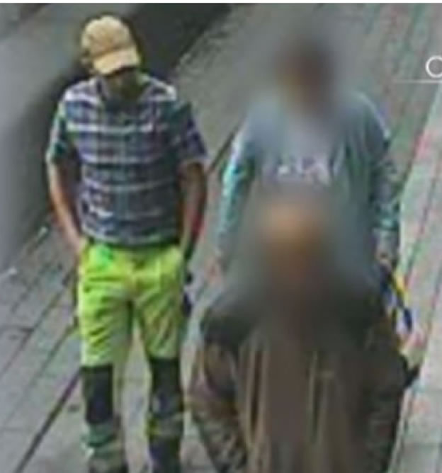 suspect walking with woman he allegedly scammed