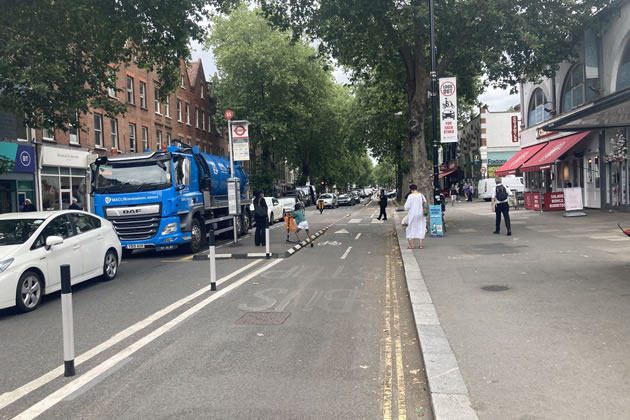 The two way cycle lane occupies what was once a lane for cars and buses
