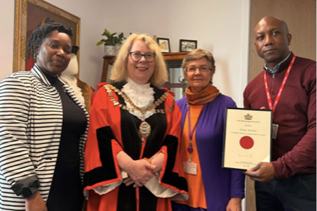 Denny Anthony of the Hogarth Youth and Community Centre receiving his certificate from the mayor, Cllr Karen Smith, with his colleague, senior youth worker, Naomi Alleyne. Picture: Cllr Joanna Biddolph 