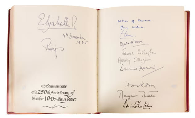 A page from the book with Queen Elizabeth II's signature top left