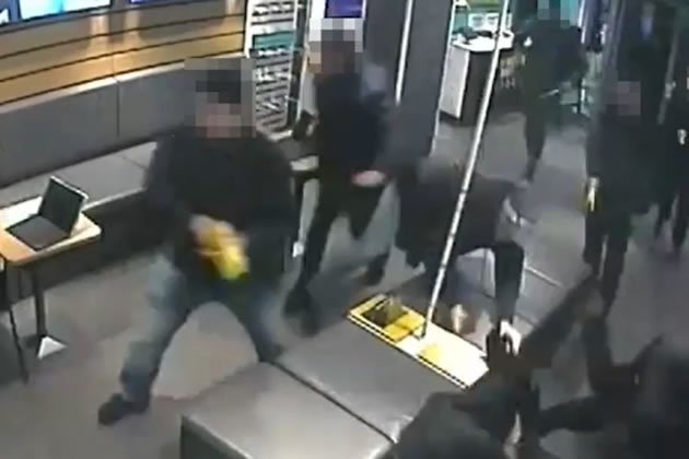 The robbers during a raid on an EE mobile phone shop