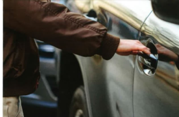thief at car door 