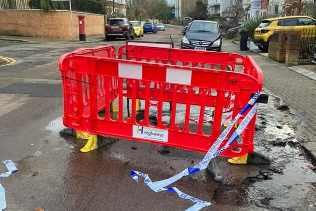 Barriers over the site of the leak on Oxford Road South