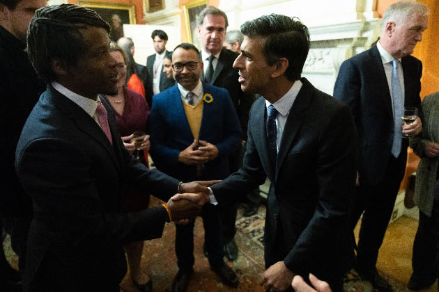 Cllr Ron Mushiso shakes hands with the Prime Minister 