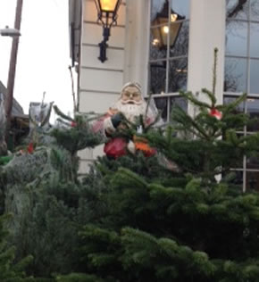 the santa which was removed fromm the street is now behind the railings