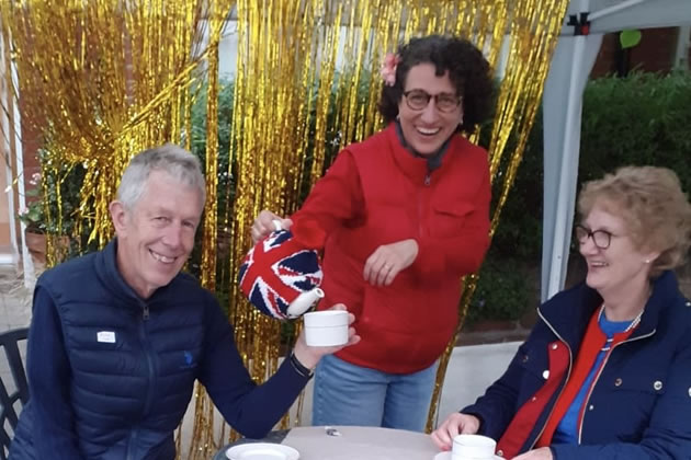 The band members have a cup of Jubilee tea 