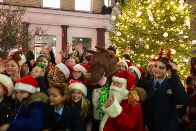 The choir from Chiswick School's Performing Arts Department sang seasonal favourites
