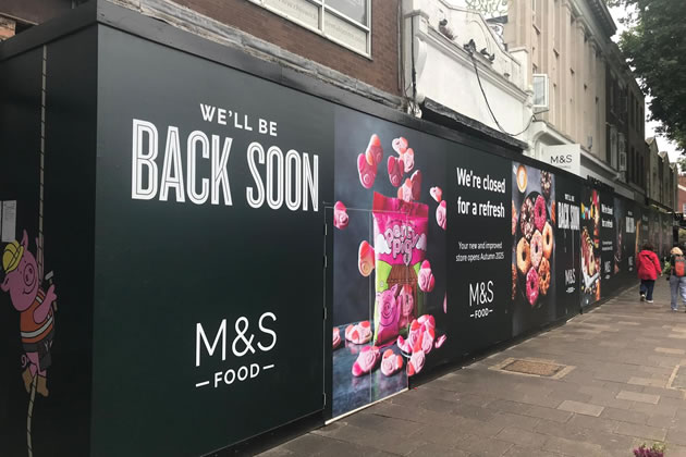 The hoardings covering Chiswick's Marks and Spencer as work progresses 